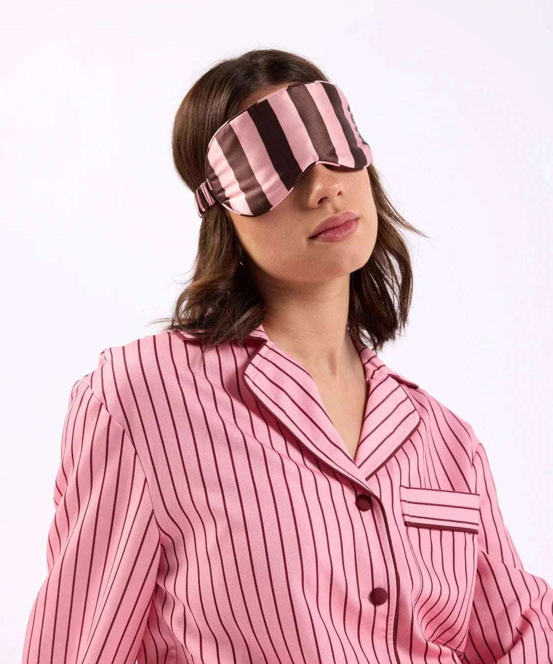 woman with eye mask over head