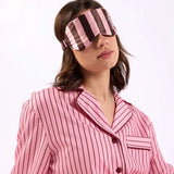 woman with eye mask over head