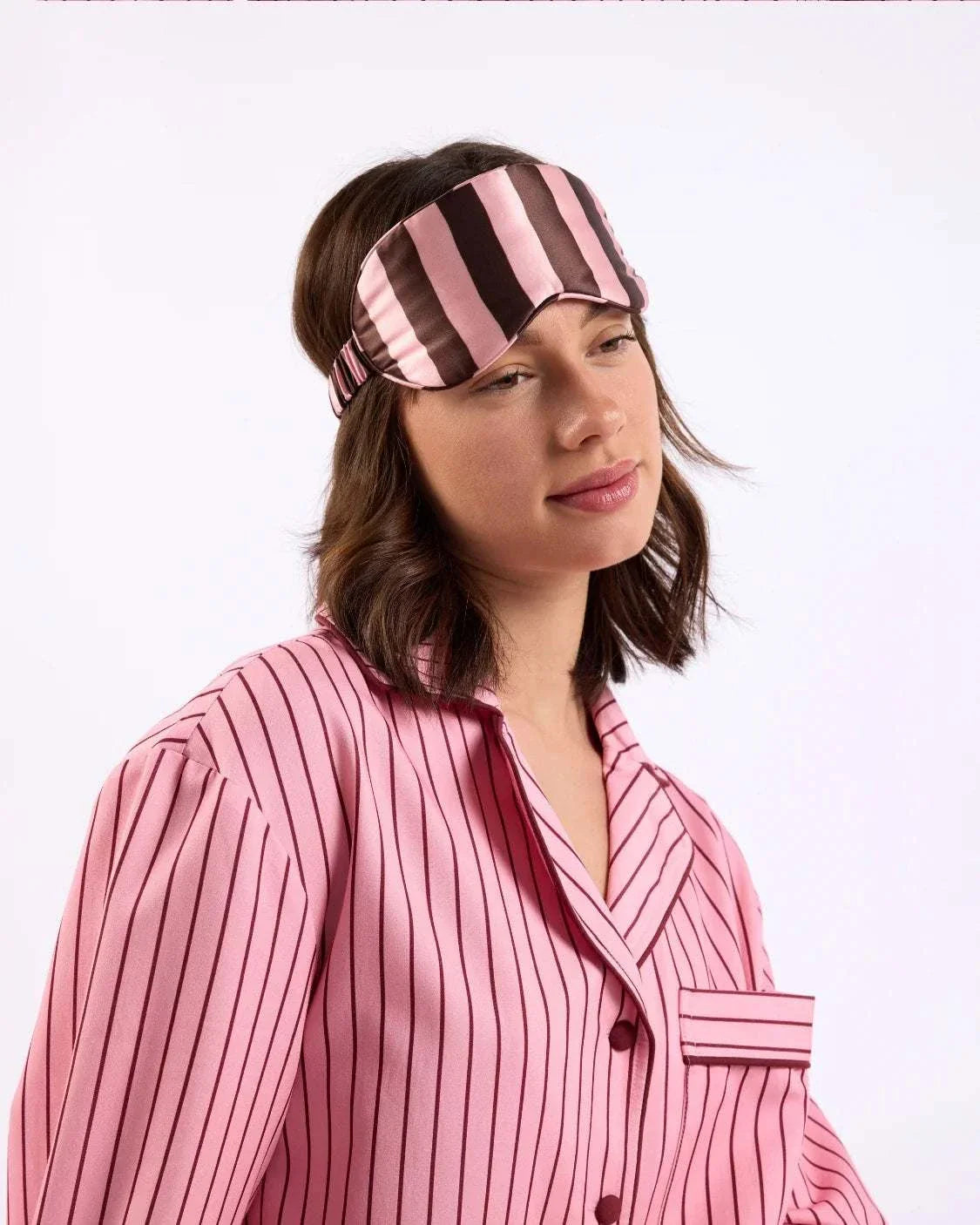 woman with eye mask over head