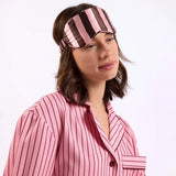 woman with eye mask over head