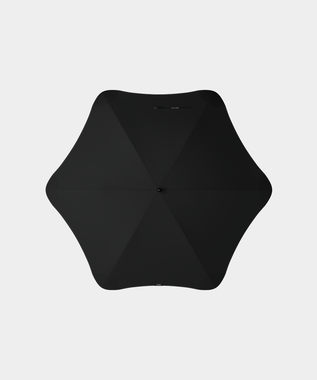 Black sport umbrella with hexagonal canopy and ergonomic handle designed for performance and protection in various weather conditions