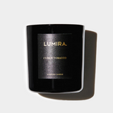Black LUMIRA Cuban Tobacco scented candle with gold lettering in a sleek jar, evoking old Havana's rich and sophisticated aroma.