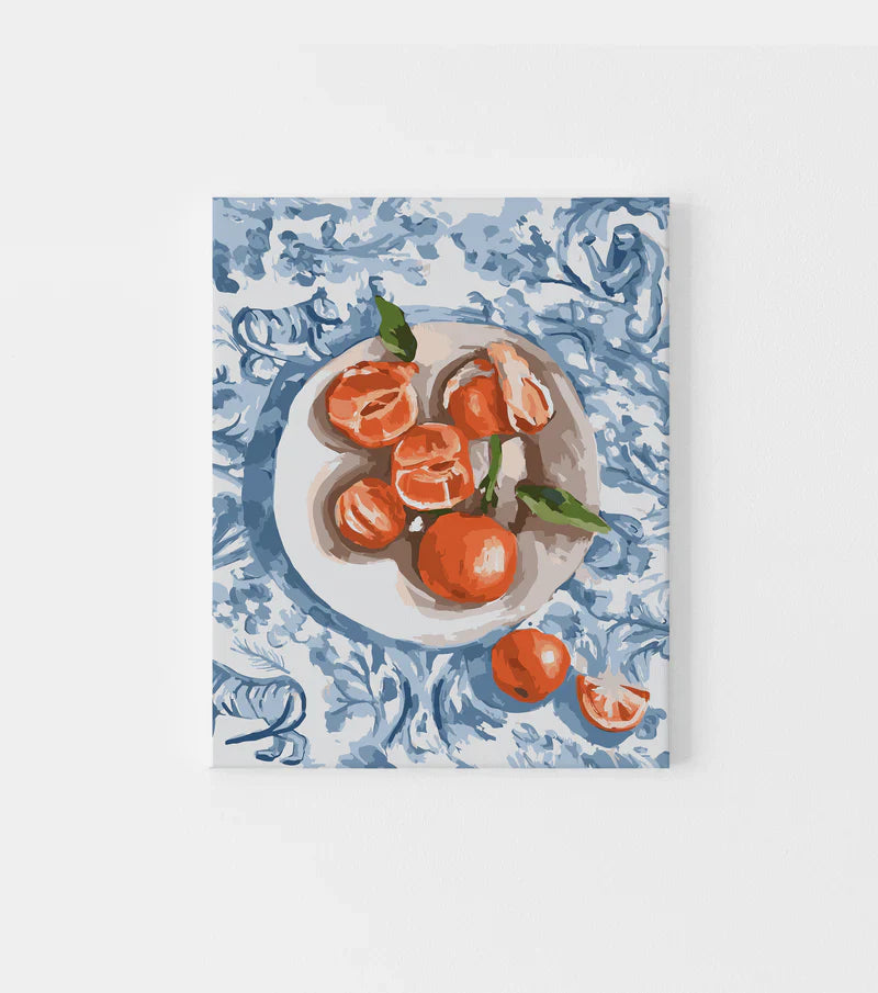 Paint by Numbers kit featuring a detailed painting of mandarins on a plate with a blue patterned background