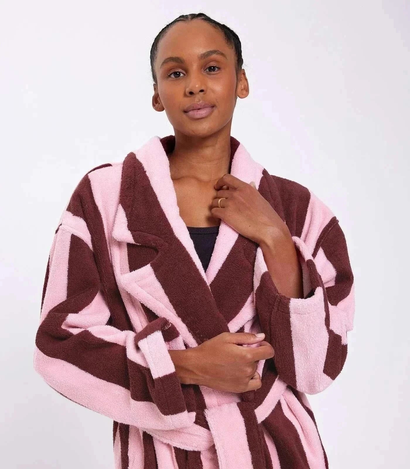 woman standing with bath robe on
