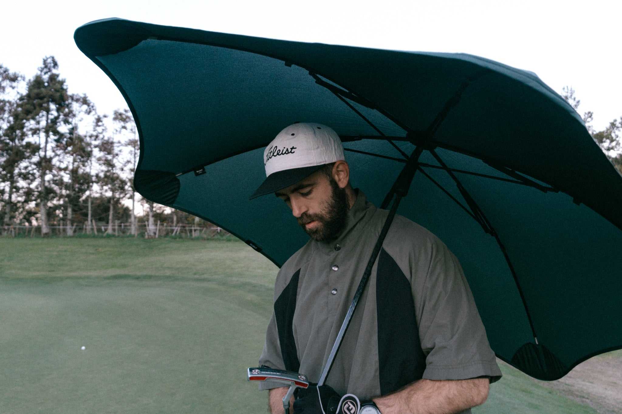 man holding sports umbrella