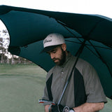 man holding sports umbrella