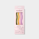 Pack of multi-colored wavy reusable glass straws in eco-friendly packaging for hot and cold drinks