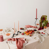 tablescape with food, candles, napkins and ceramics