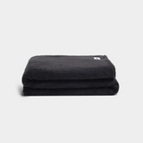Charcoal faux fur throw blanket folded, ultra-soft vegan plush, 150cm x 210cm, cozy winter comfort