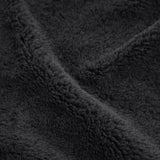 up close shot of texture of black fluffy throw blanket