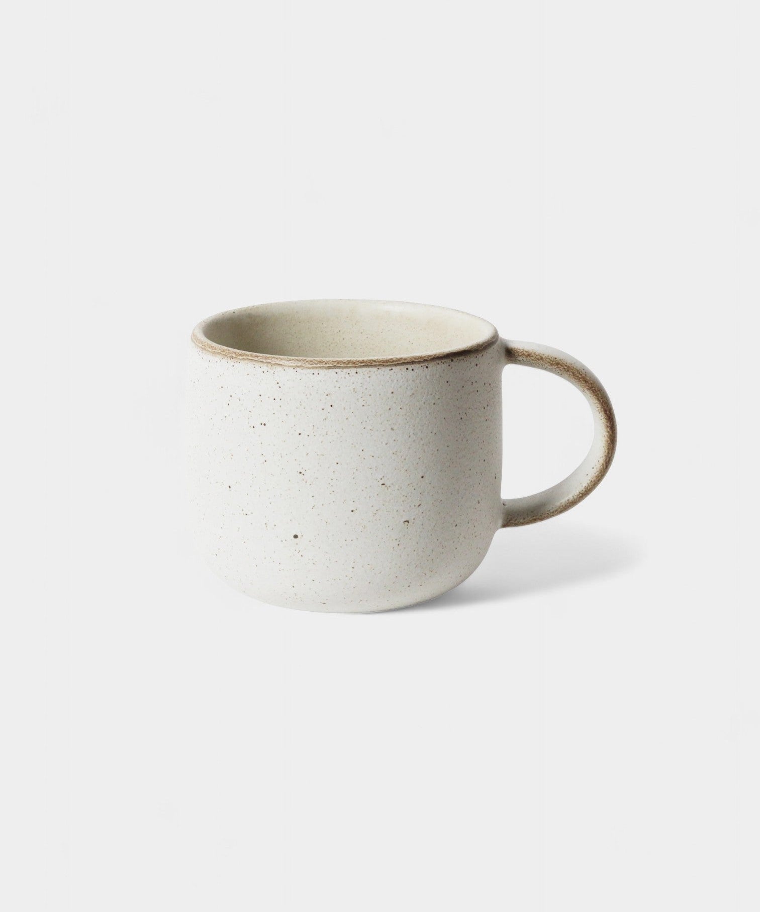 Set of four limestone mugs with a comfortable handle and speckled design for everyday use