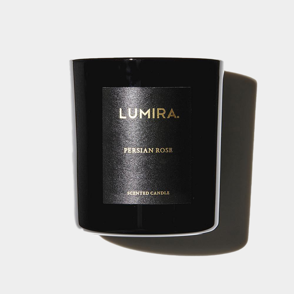 Black Lumira Persian Rose scented candle with gold lettering, combining rose, bergamot, mandarin, amber, musk, and patchouli aroma