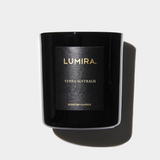 Terra Australis Scented Candle by Lumira in a sleek black jar with gold lettering, evoking Australian outback aromas.