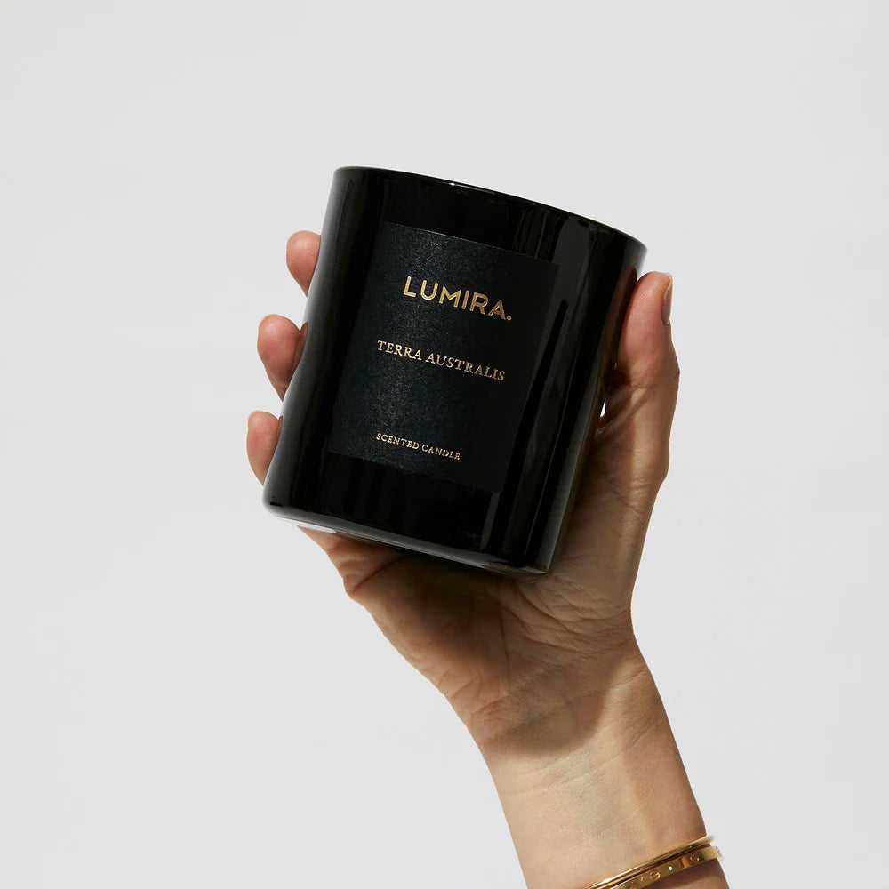 woman holding up candle