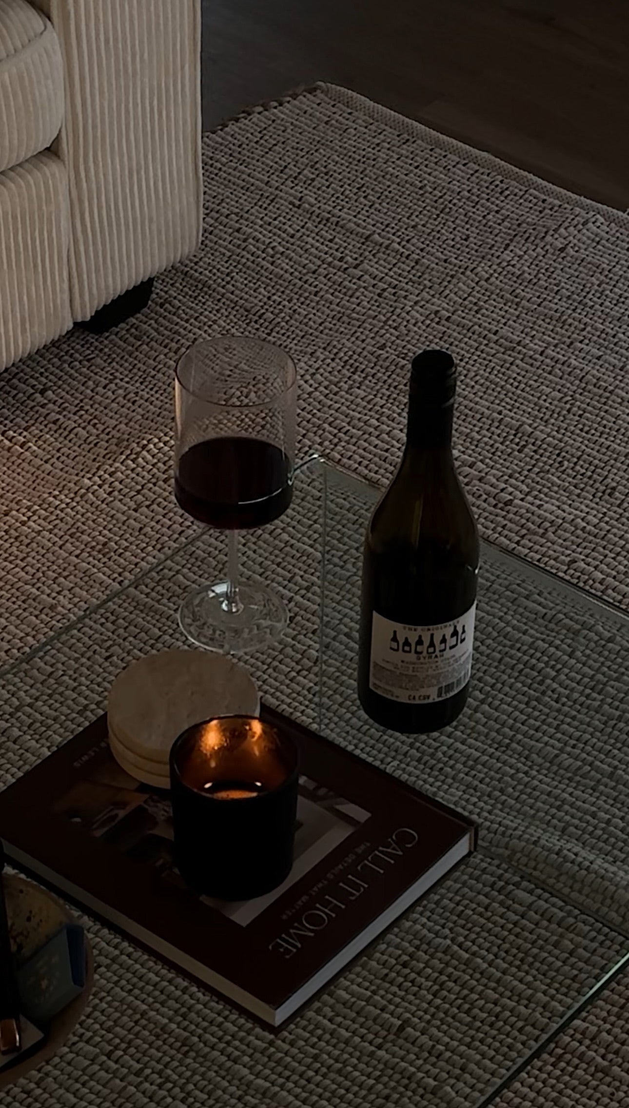candle sitting on a coffee table 