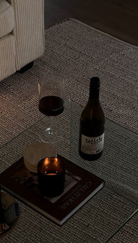 candle sitting on a coffee table 