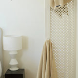 beige face washer towel hanging up