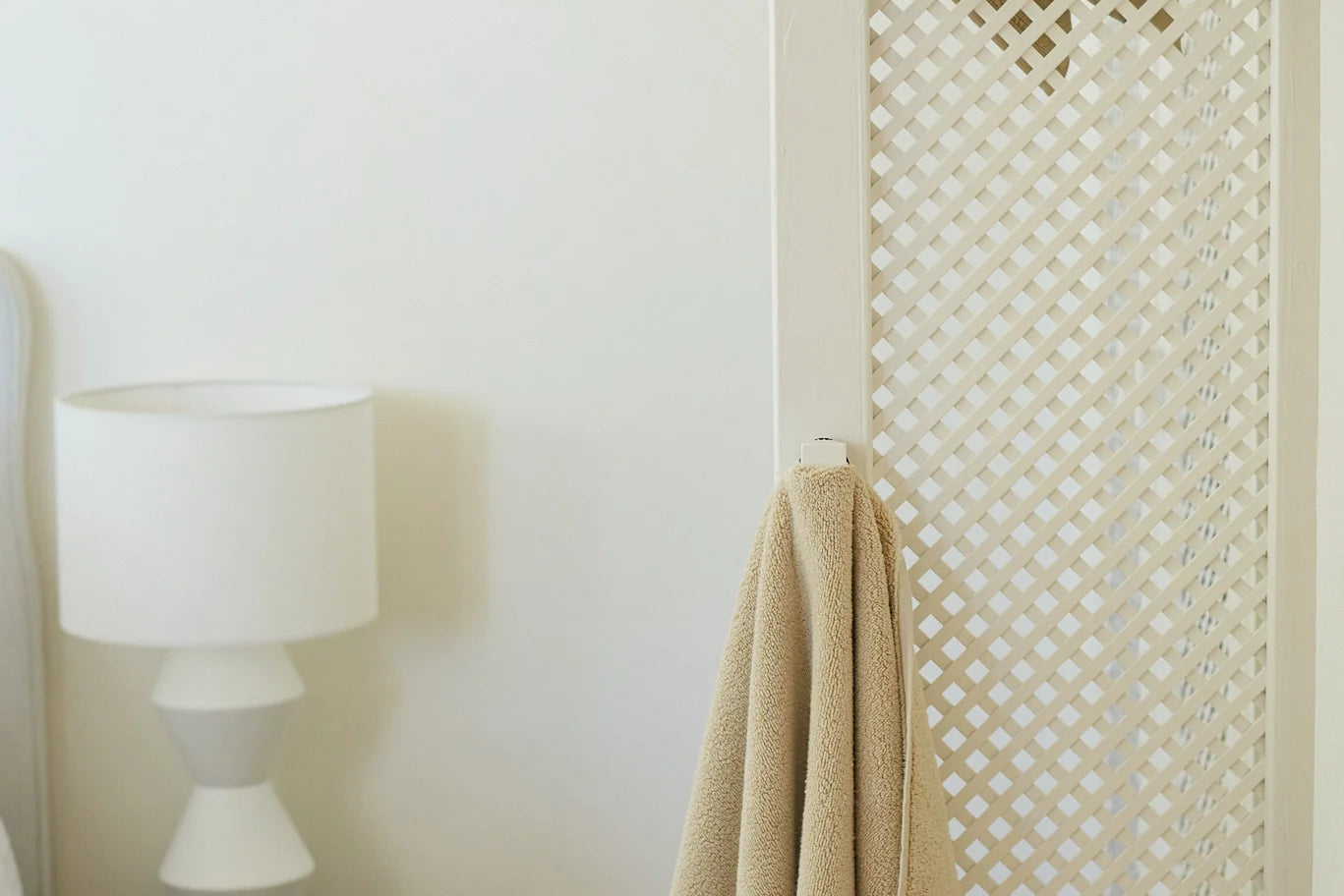 beige face washer towel hanging up