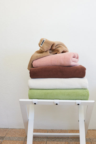 different coloured towels sitting in stack 