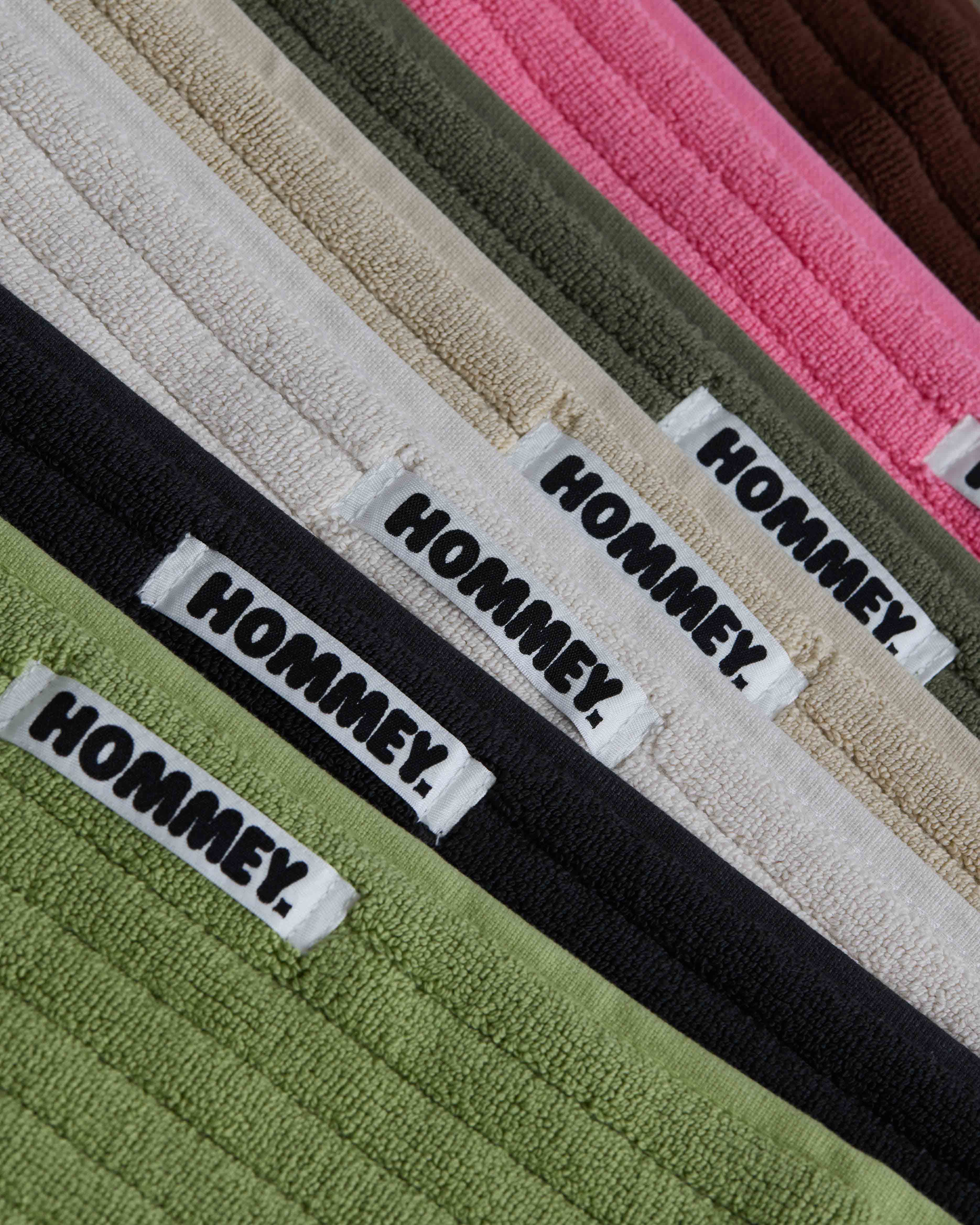 different coloured of bath mats sitting together