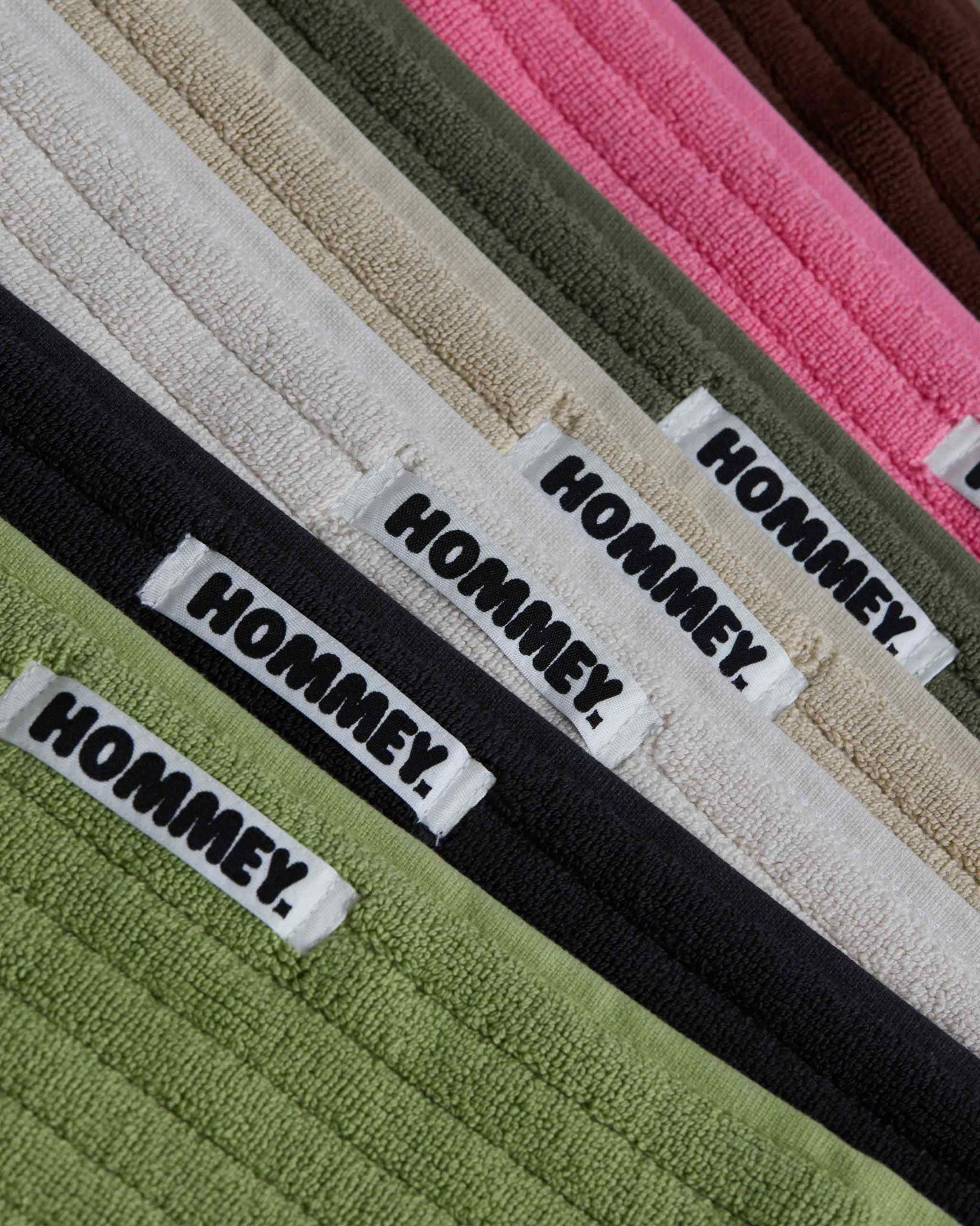 different coloured bath mats sitting together