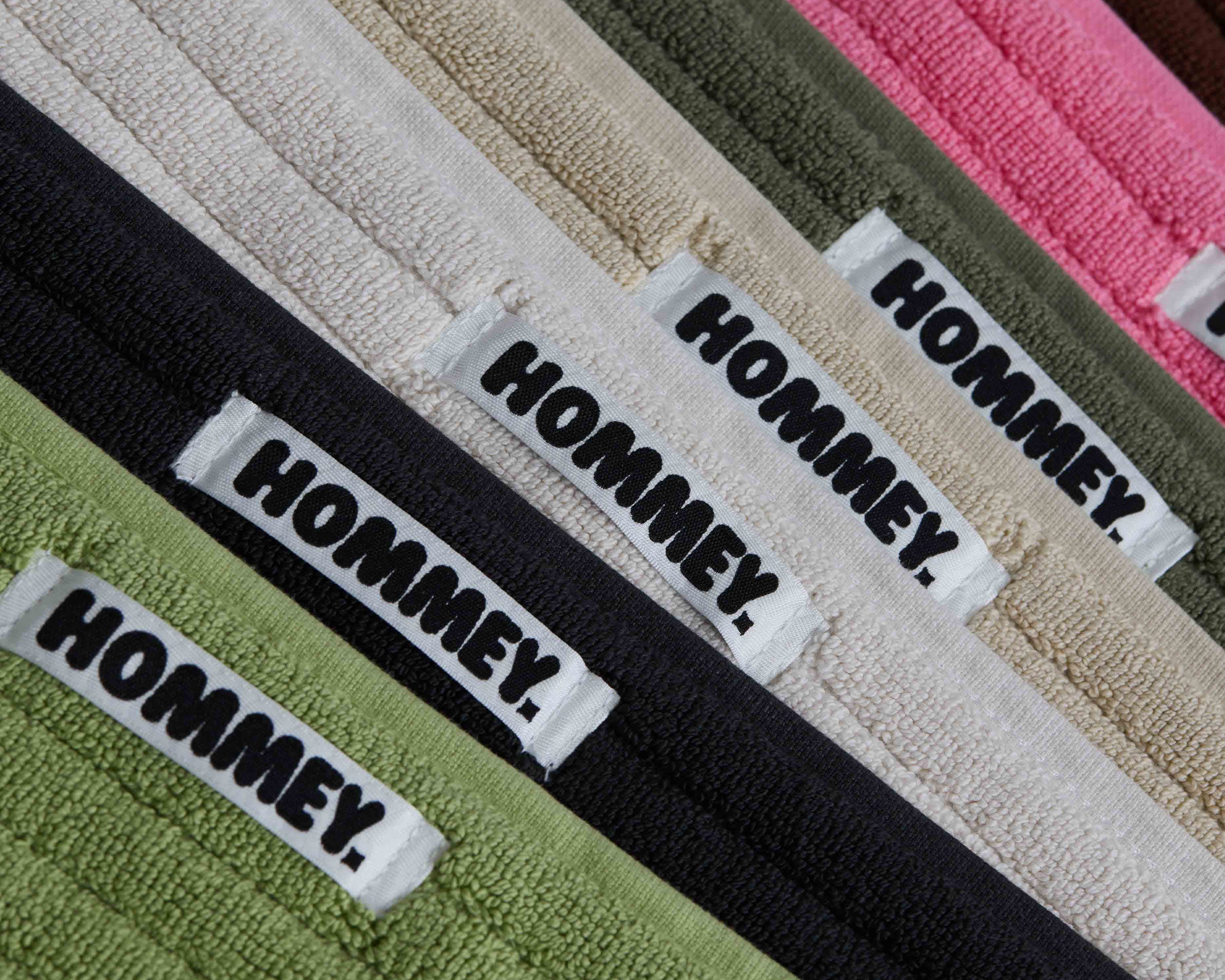 different coloured bath mats sitting together