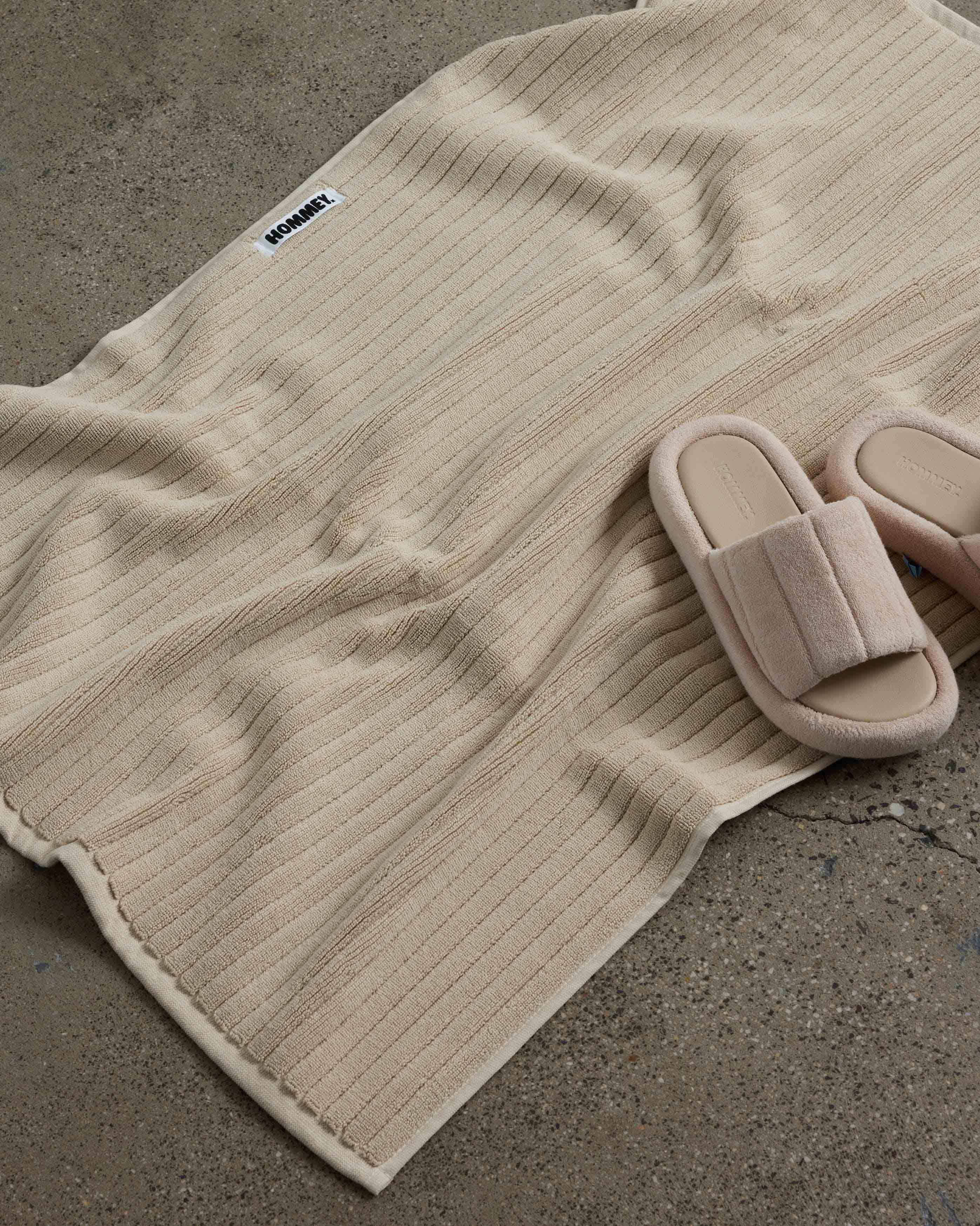 shoes next to beige bath mat