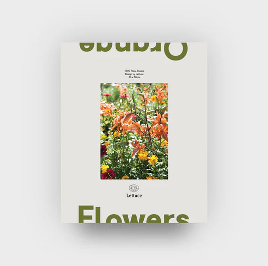 puzzle set of orange flowers sitting on white background