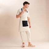 guy standing in white and black apron