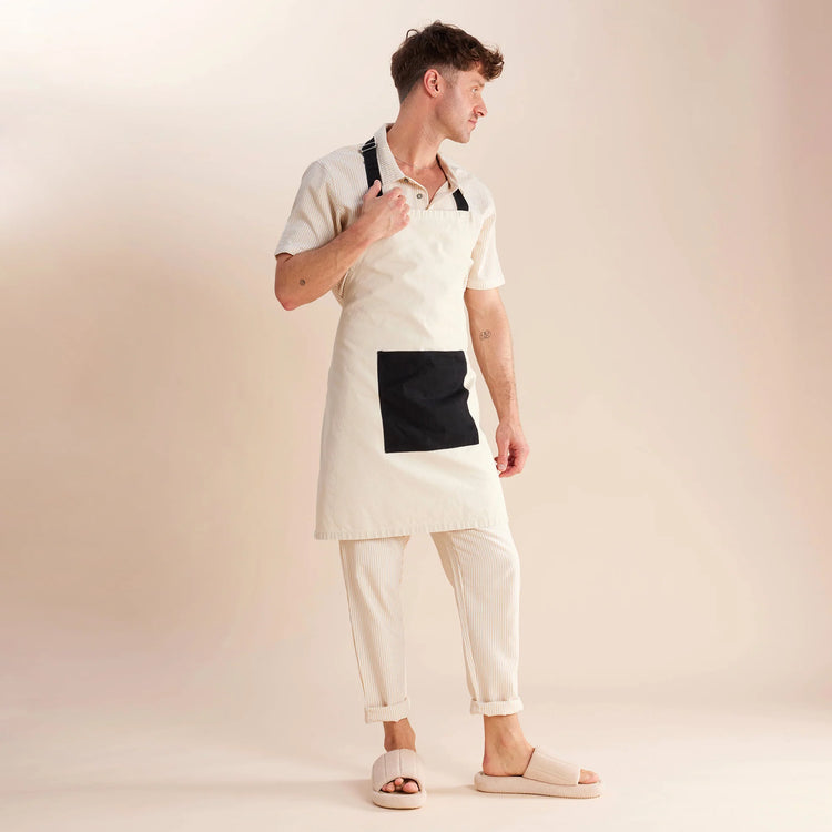 guy standing in white and black apron