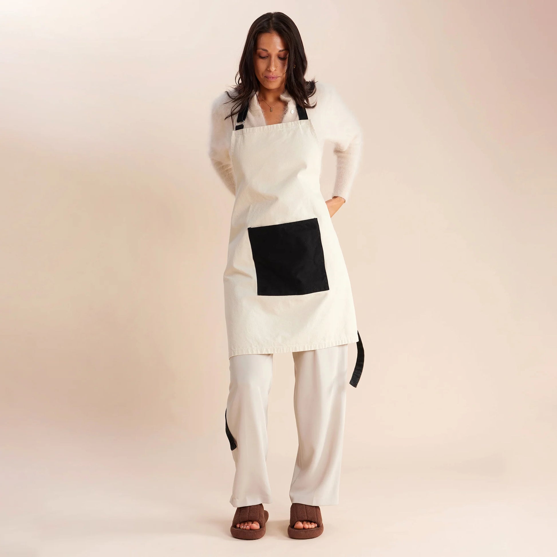 woman standing in white and black apron