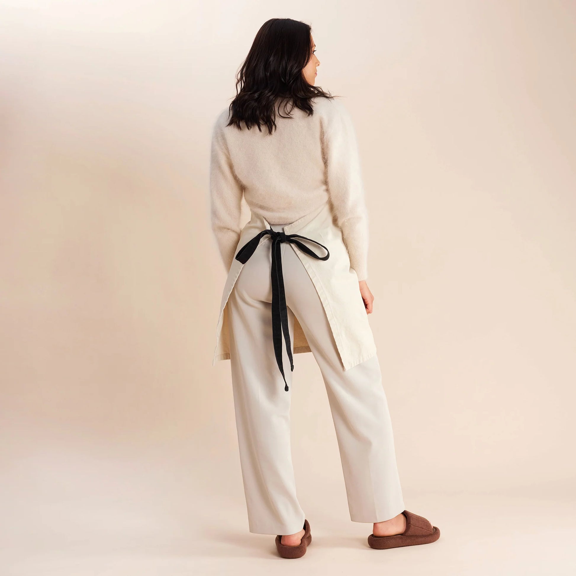 woman standing in white and black apron