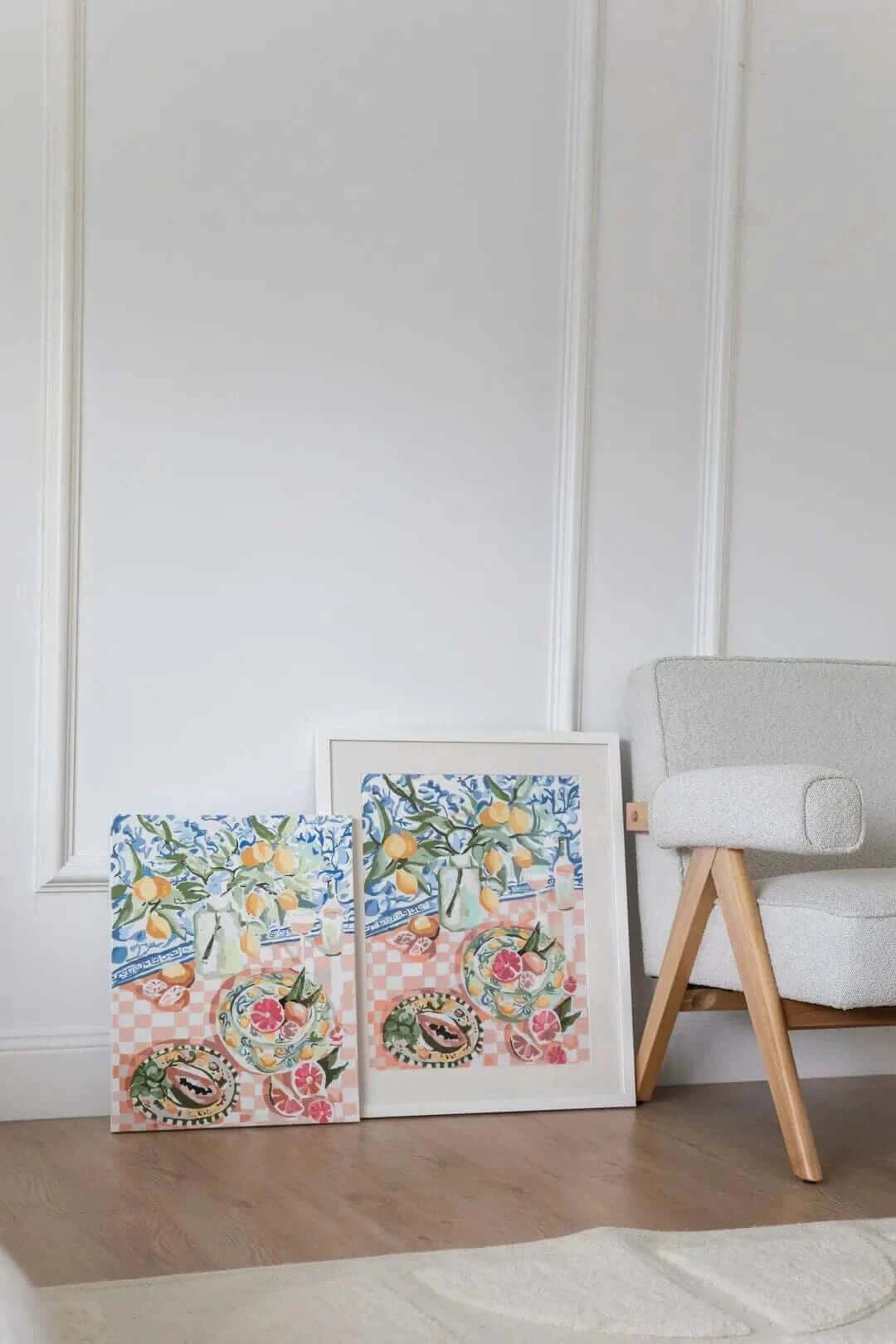 wall art of citrus and fruit on a table sitting against the wall