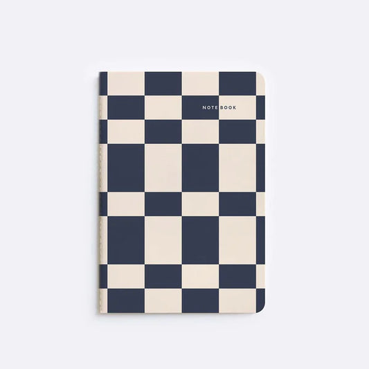 notebook with checker tile pattern sitting on white background