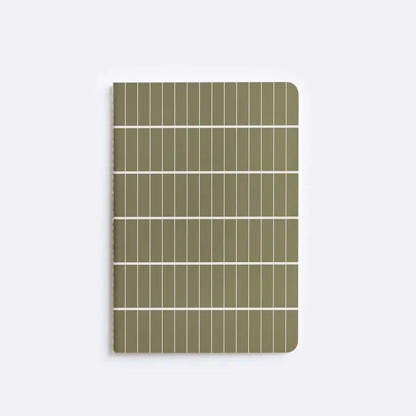  notebook with olive tile pattern sitting on white background