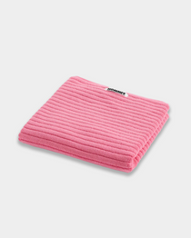 Pink ribbed plush bath mat folded, spa-like texture for bathroom comfort