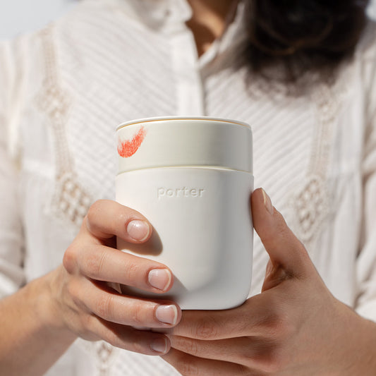 girl holding cream ceramic takeaway mug 