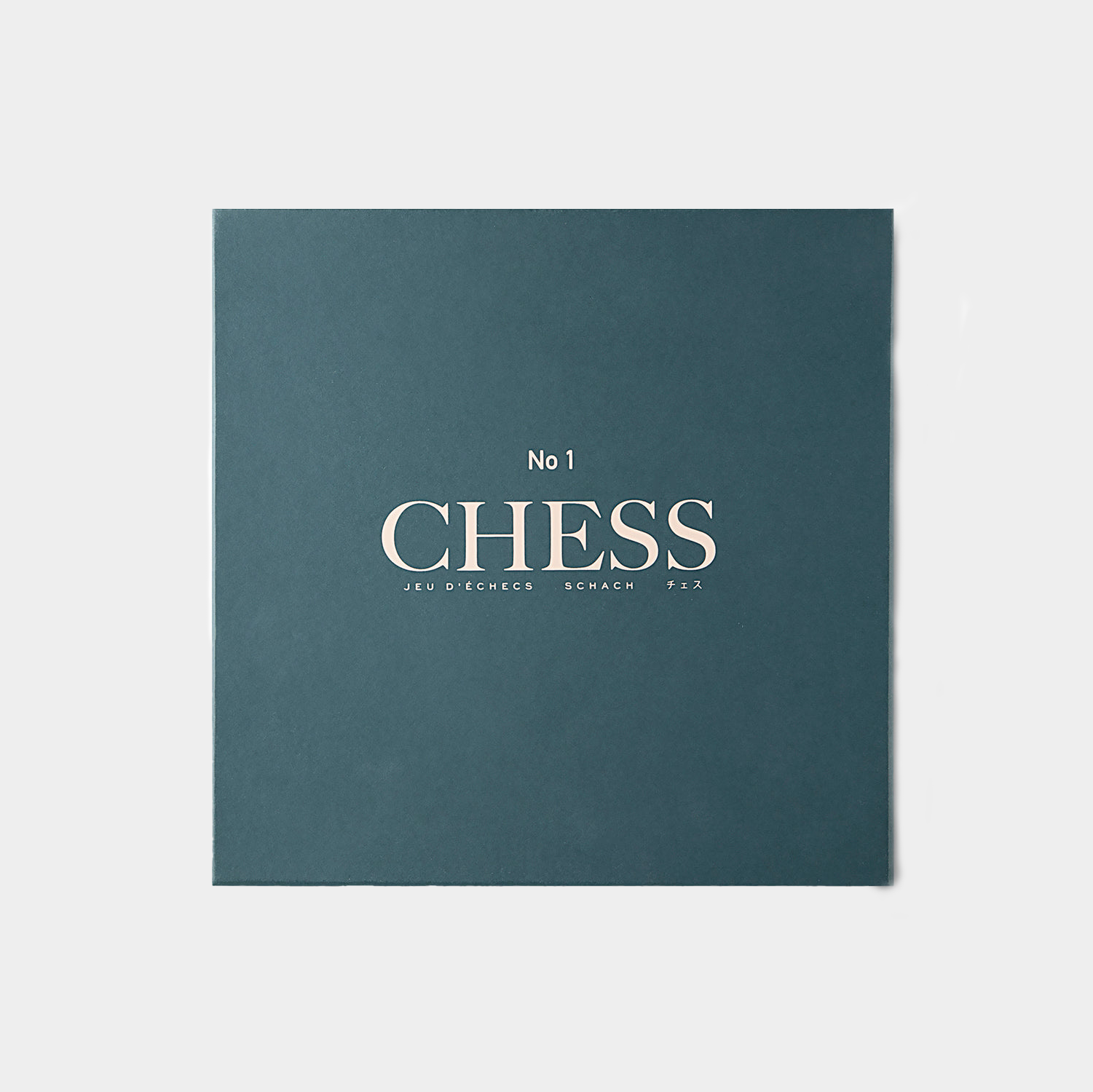 blue green chess set packaging on white background