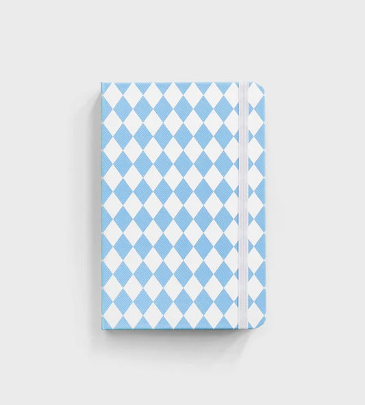 notebook with blue diamond pattern sitting on white background