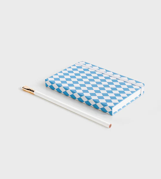 notebook with blue diamond pattern lying down on white background