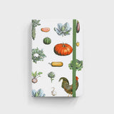 notebook with vegetable pattern sitting on white background