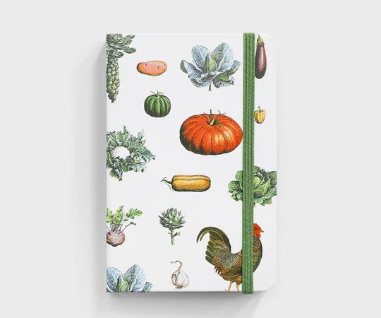 notebook with vegetable pattern sitting on white background