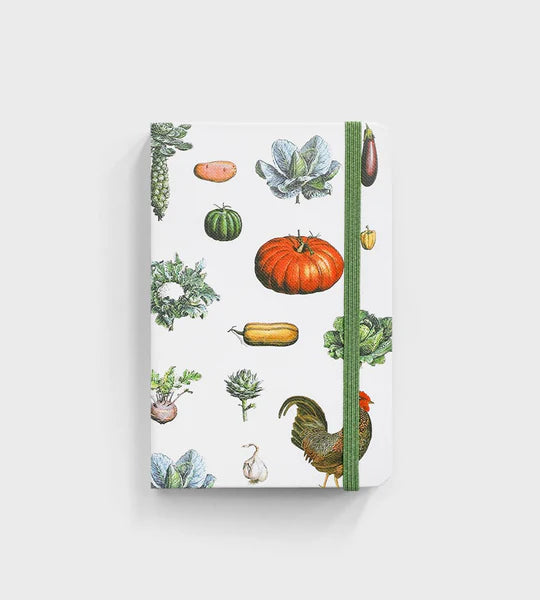 notebook with vegetable pattern sitting on white background
