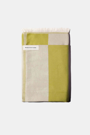 pistachio green and white folded green towel