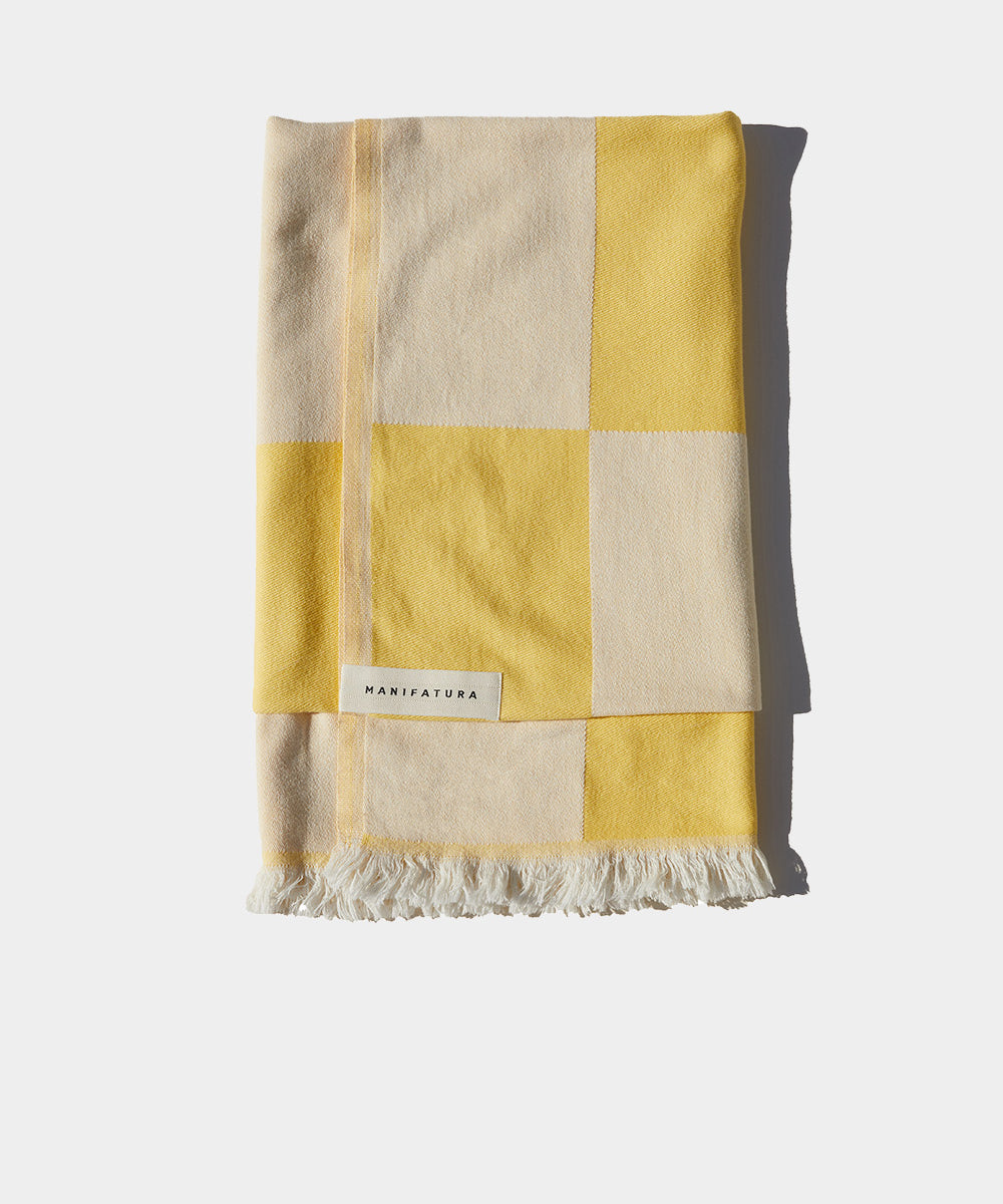 citrus yellow and white beach towel folded