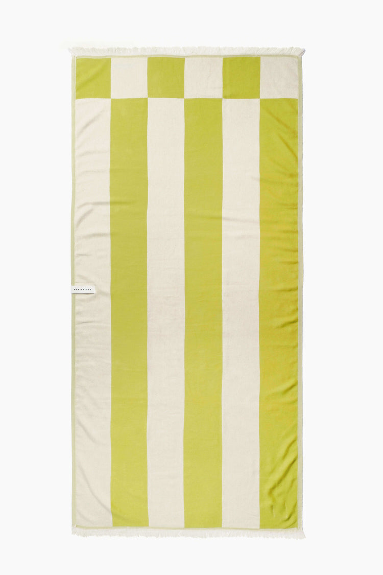 pistachio green and white beach towel laid out flat 