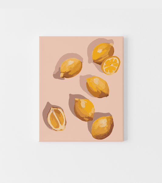 wall art of lemons on a soft pink background