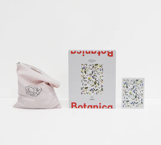 opened up set of a puzzle with flowers on it sitting on white background