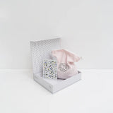 opened up set of a puzzle with flowers on it sitting on white background