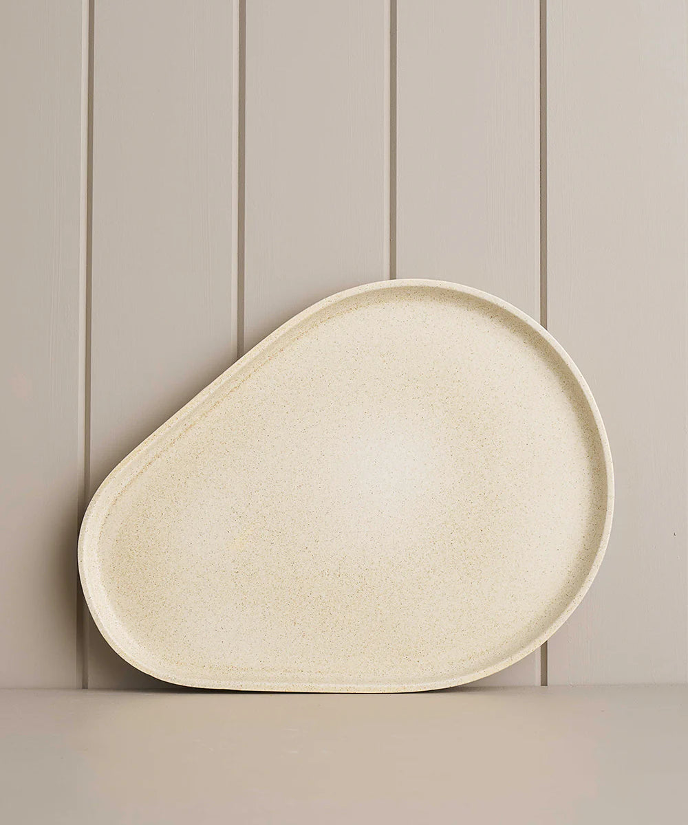 platform sand platter on a wooden shelf